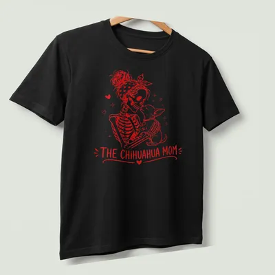 Vintage illustration of a skeleton woman with her Chihuahua, featuring bold lettering above — printed on a unisex t-shirt (angled view)