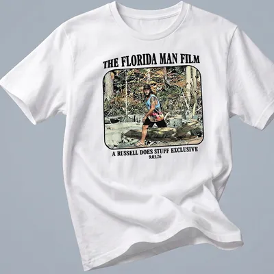Cartoon graphic of a Florida man wrestling an alligator with colorful text — printed on a unisex t-shirt