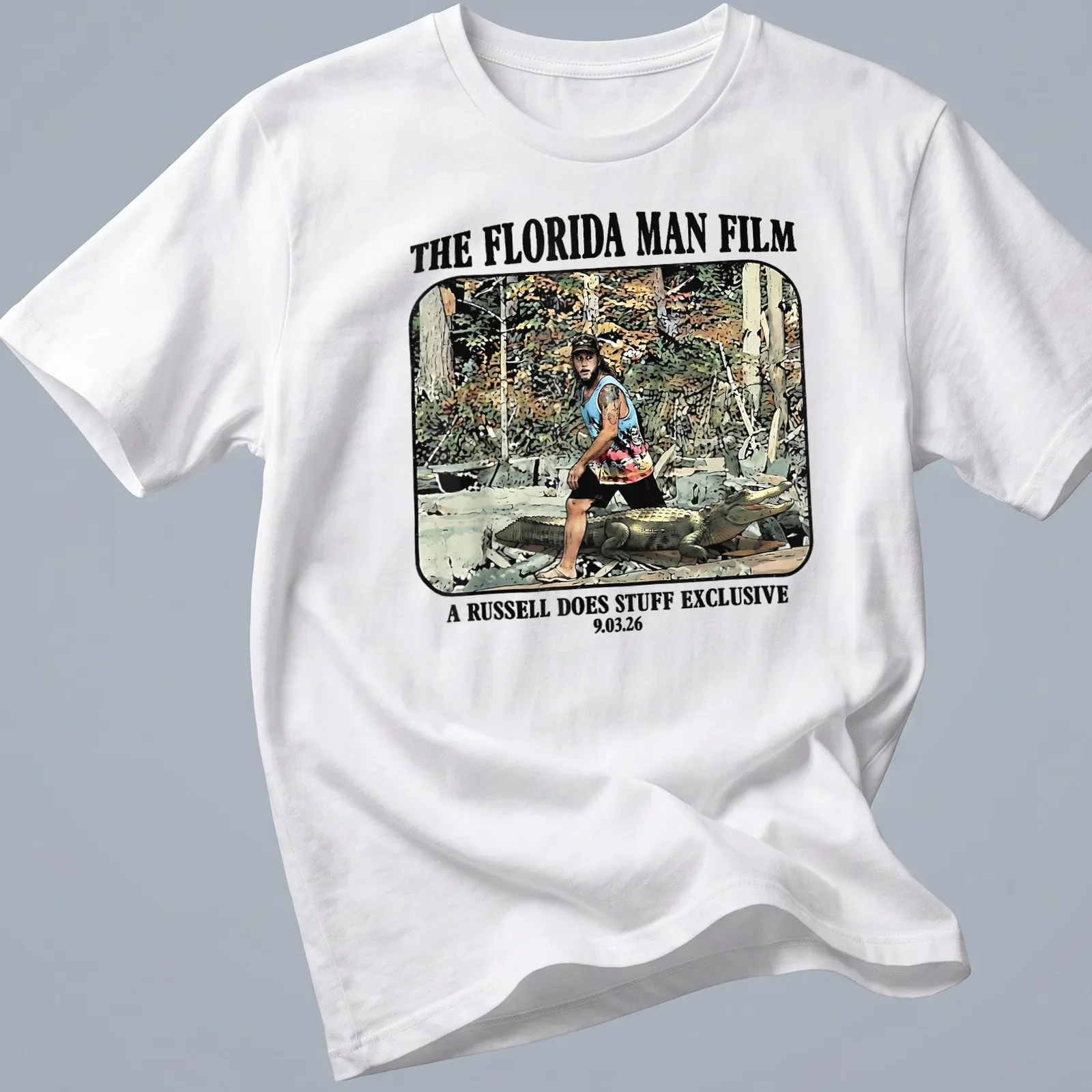 Cartoon graphic of a Florida man wrestling an alligator with colorful text — printed on a unisex t-shirt