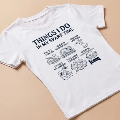 Illustrative t-shirt featuring a Labrador Retriever and humorous text about Labrador activities — printed on a women's shirt
