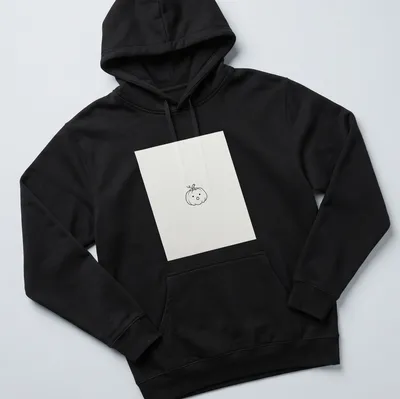 Line-art drawing of a tiny pumpkin on a white — printed on a unisex hoodie