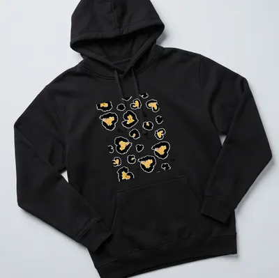 Abstract leopard heart spots in gold, black, and white on a T-shirt. — printed on a unisex hoodie