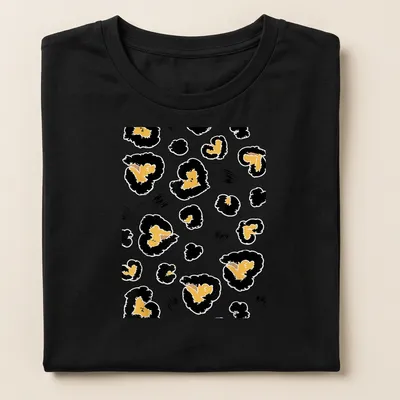 Abstract leopard heart spots in gold, black, and white on a T-shirt. — printed on a women's shirt