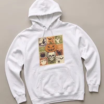 Vintage distressed Halloween design featuring pumpkin, skull, witch, and cat — printed on a unisex hoodie