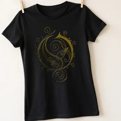 Vintage ornate swirl design in gold, black, and white on a — printed on a women's shirt