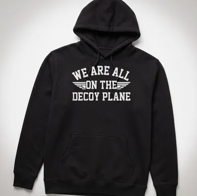 Bold typography t-shirt with the phrase 'We Are All On The Decoy Plane' and wings design in white — printed on a unisex hoodie