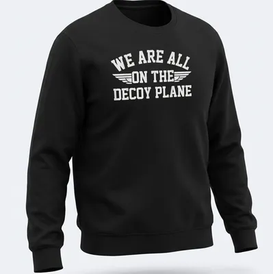 Bold typography t-shirt with the phrase 'We Are All On The Decoy Plane' and wings design in white — printed on a unisex sweatshirt