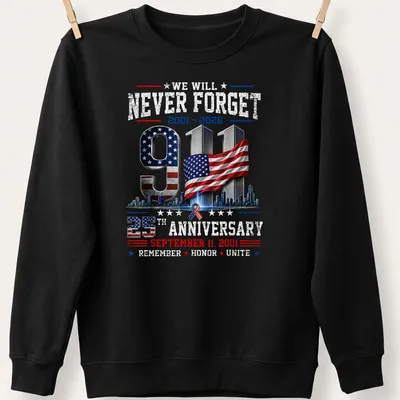 Patriotic graphic T-shirt featuring 9/11 memorial and American flag colors — printed on a unisex sweatshirt