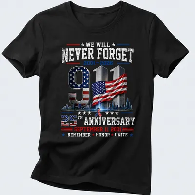Patriotic graphic T-shirt featuring 9/11 memorial and American flag colors — printed on a women's shirt