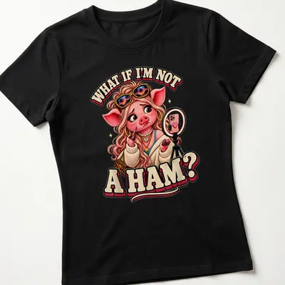 Cartoon pig character with the text 'What If I'm Not A Ham?' in playful colors. — printed on a women's shirt