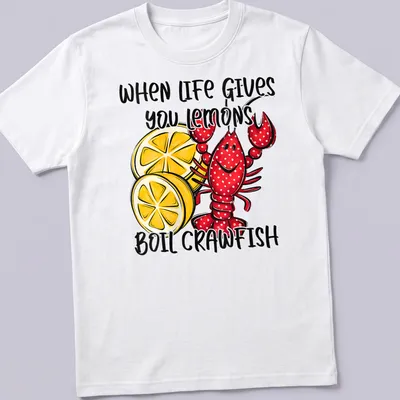 Playful cartoon shirt featuring red crawfish and lemons with humorous text — printed on a unisex t-shirt