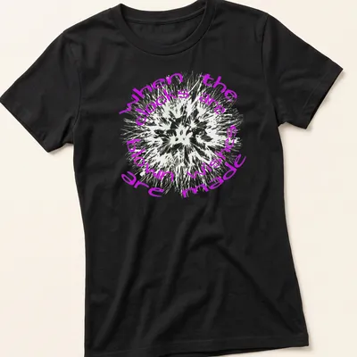 Text art shirt featuring dandelions and the phrase when the clocks are blown wishes made in purple and white — printed on a women's shirt