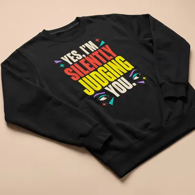 Colorful humorous text shirt featuring eyes with the phrase 'YES, I’M SILENTLY JUDGING YOU.' — printed on a unisex sweatshirt