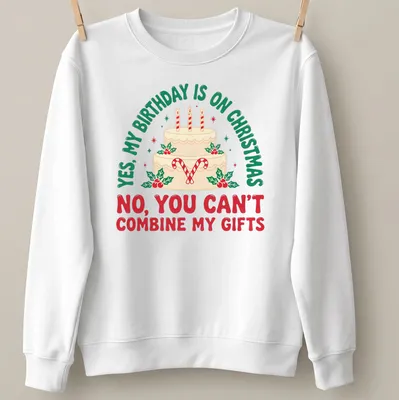 A festive T-shirt featuring a birthday cake with candles and candy canes alongside humorous text. — printed on a unisex sweatshirt