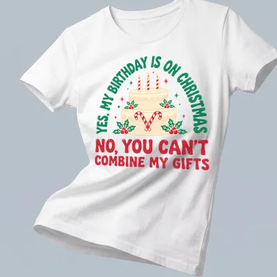 A festive T-shirt featuring a birthday cake with candles and candy canes alongside humorous text. — printed on a women's shirt