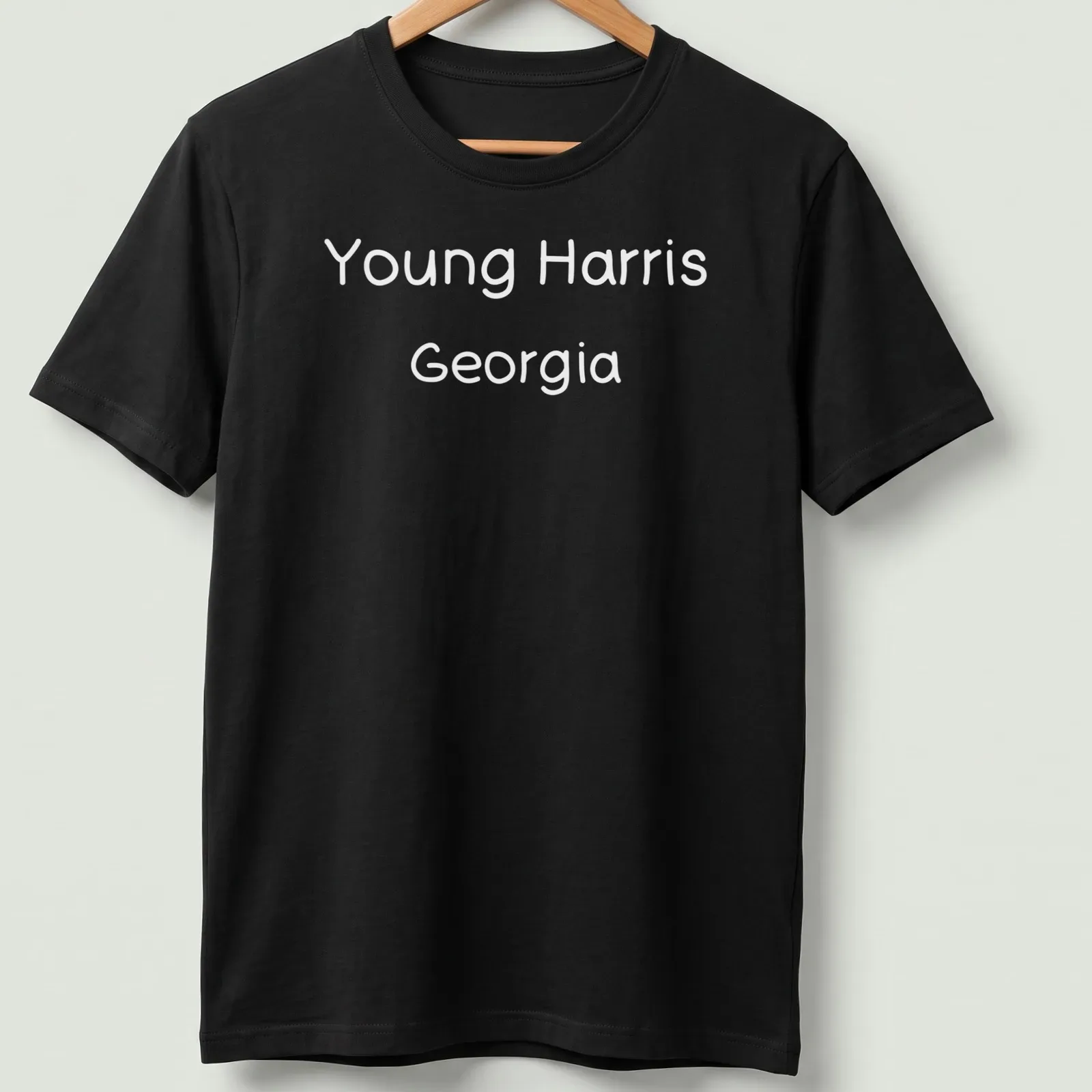 Typography design of Young Harris, Georgia in black and white text — printed on a unisex t-shirt